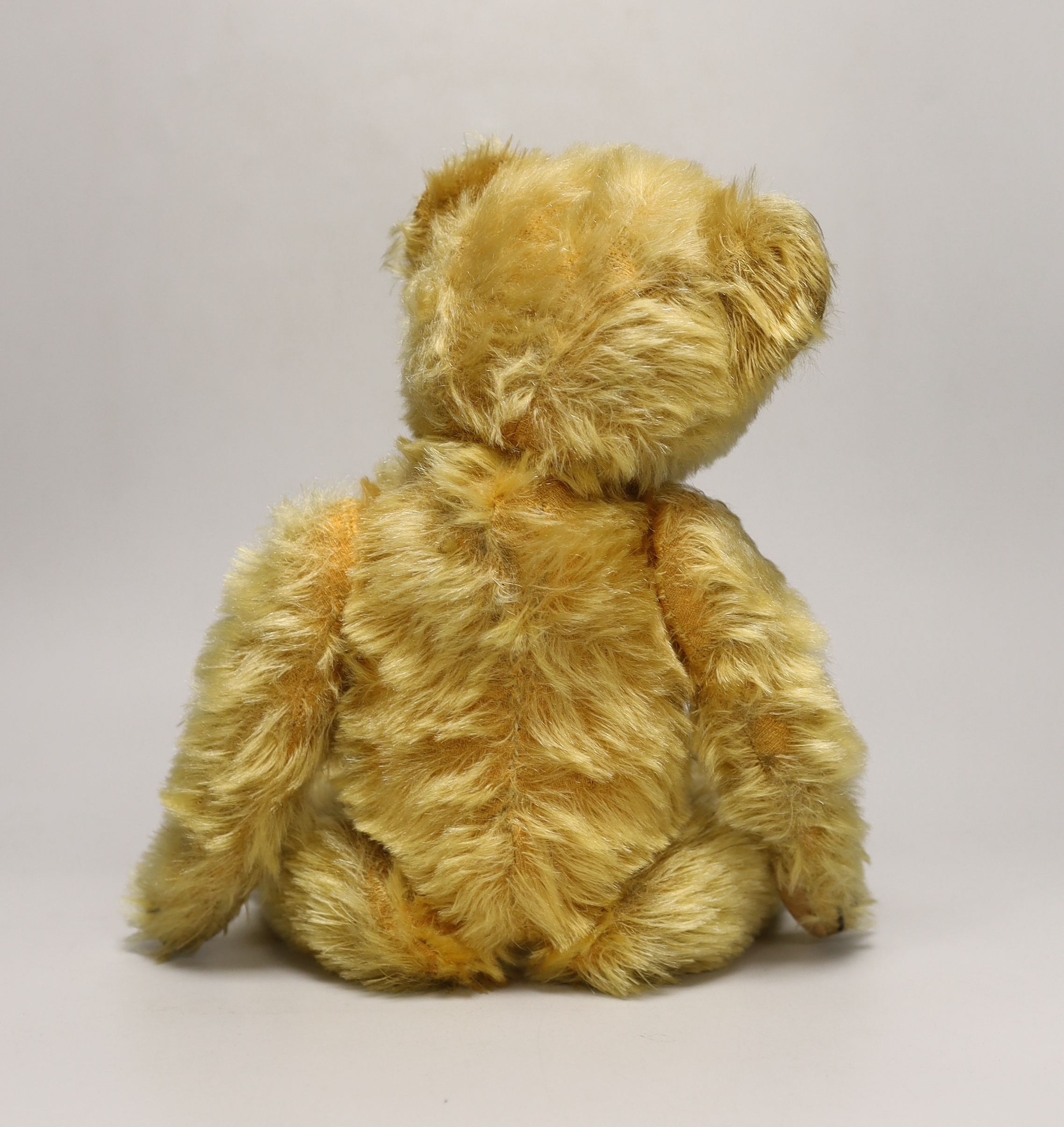 A Deans 1950's mouse eared bear, label on left foot, 16in., repair to paw pads, good mohair